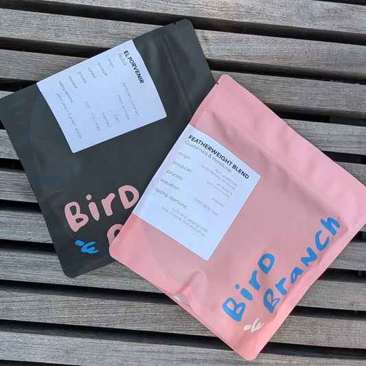 2 bags of whole bean coffee, one blend and one single origin